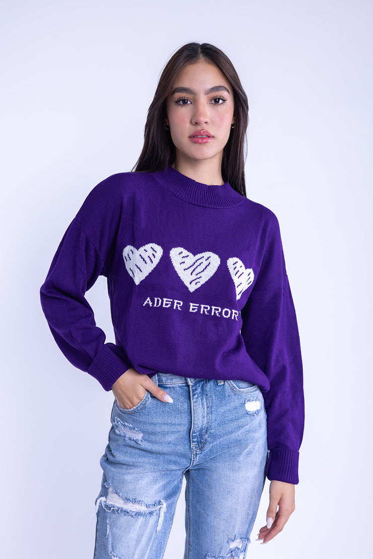 Suéter con corazones en pecho