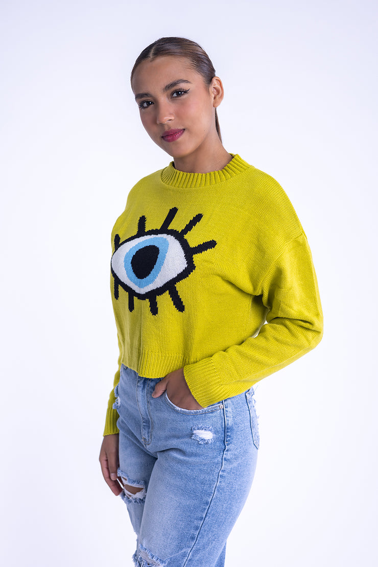 Suéter verde con diseño de ojo
