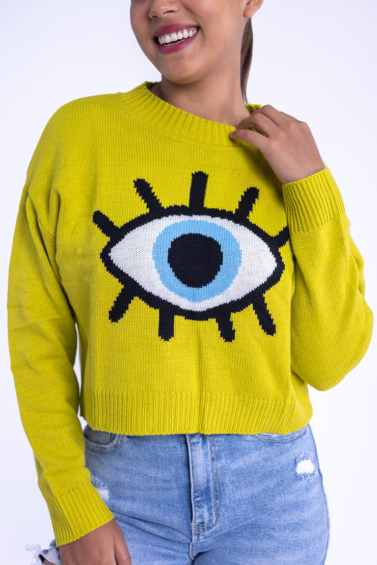 Suéter verde con diseño de ojo