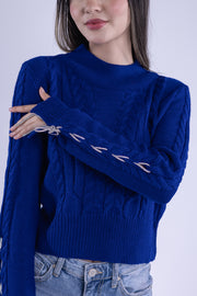 Suéter azul tejido con brillos en manga