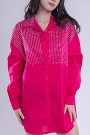Blusa oversize tipo camisa con aplicaciones