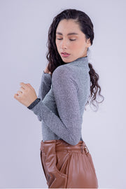 Blusa con destellos brillosos de manga larga