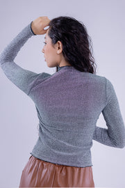 Blusa con destellos brillosos de manga larga