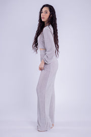 Conjunto brilloso de blusa y pantalón