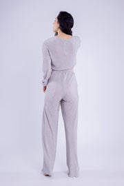 Conjunto brilloso de blusa y pantalón