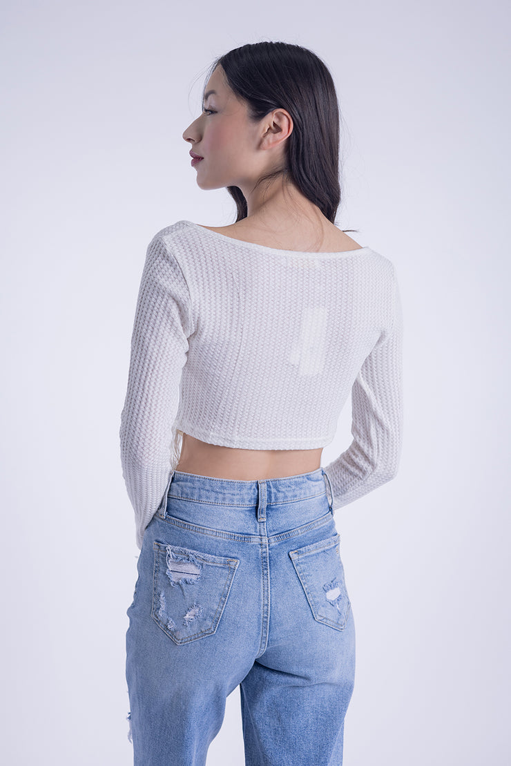 Blusa cruzada con detalla de flecos