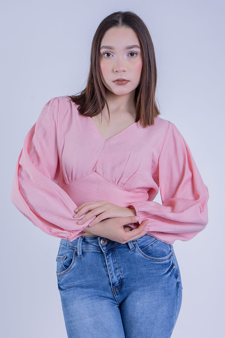 Crop top rosa con manga tipo globo