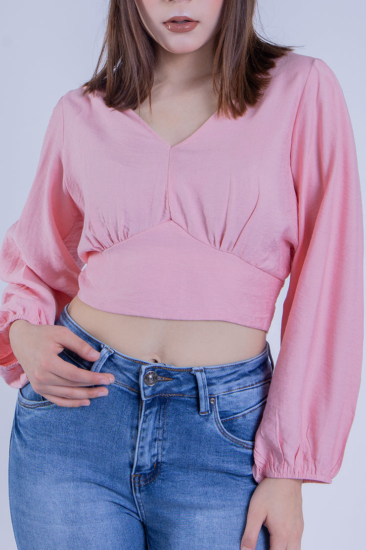Crop top rosa con manga tipo globo