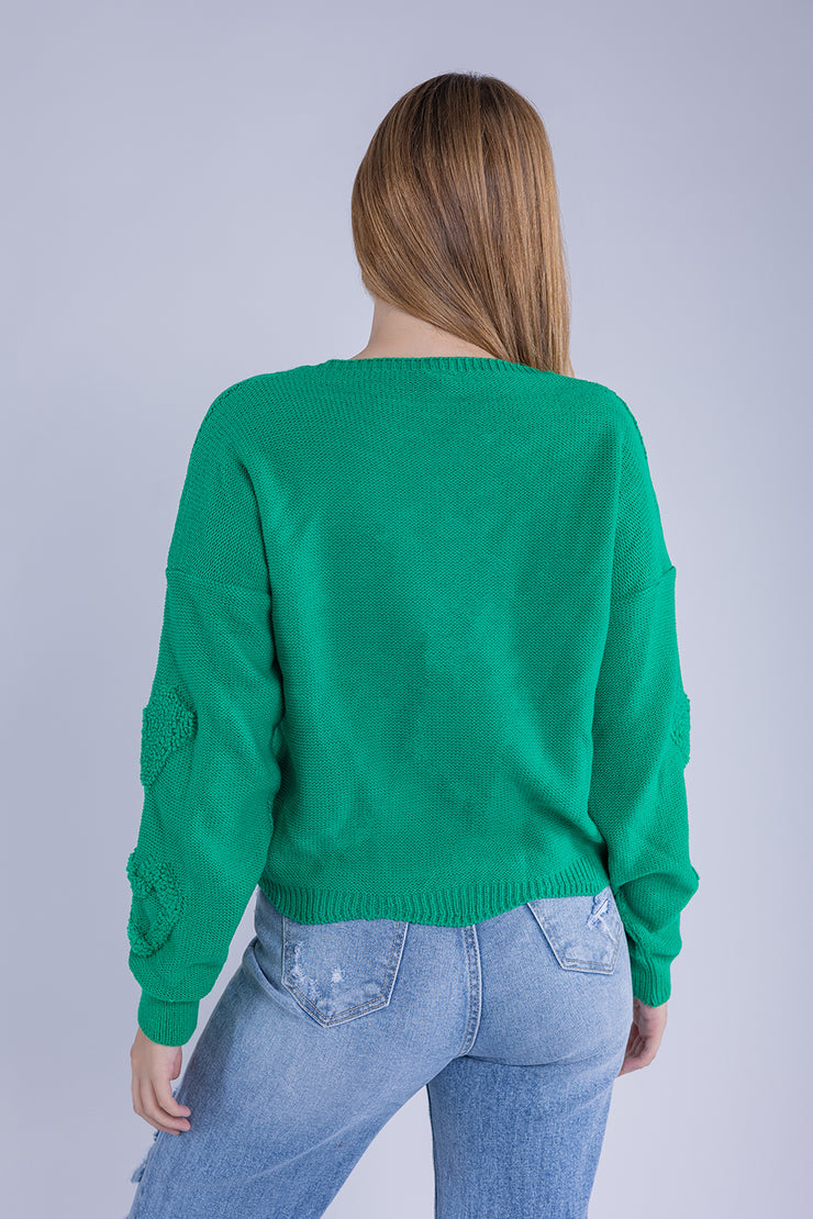 Suéter verde con diseño de corazones
