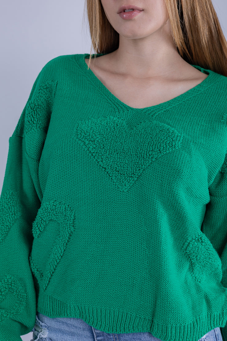 Suéter verde con diseño de corazones