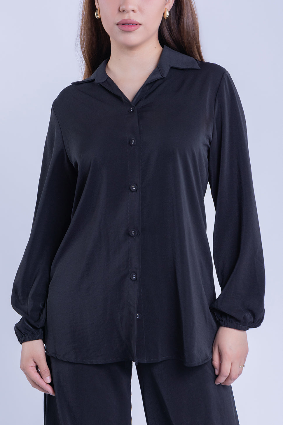 Conjunto abotonado de blusa y pantalón