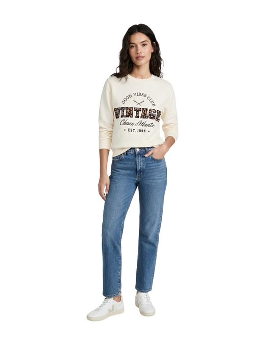 Suéter de punto beige con estampado bordado