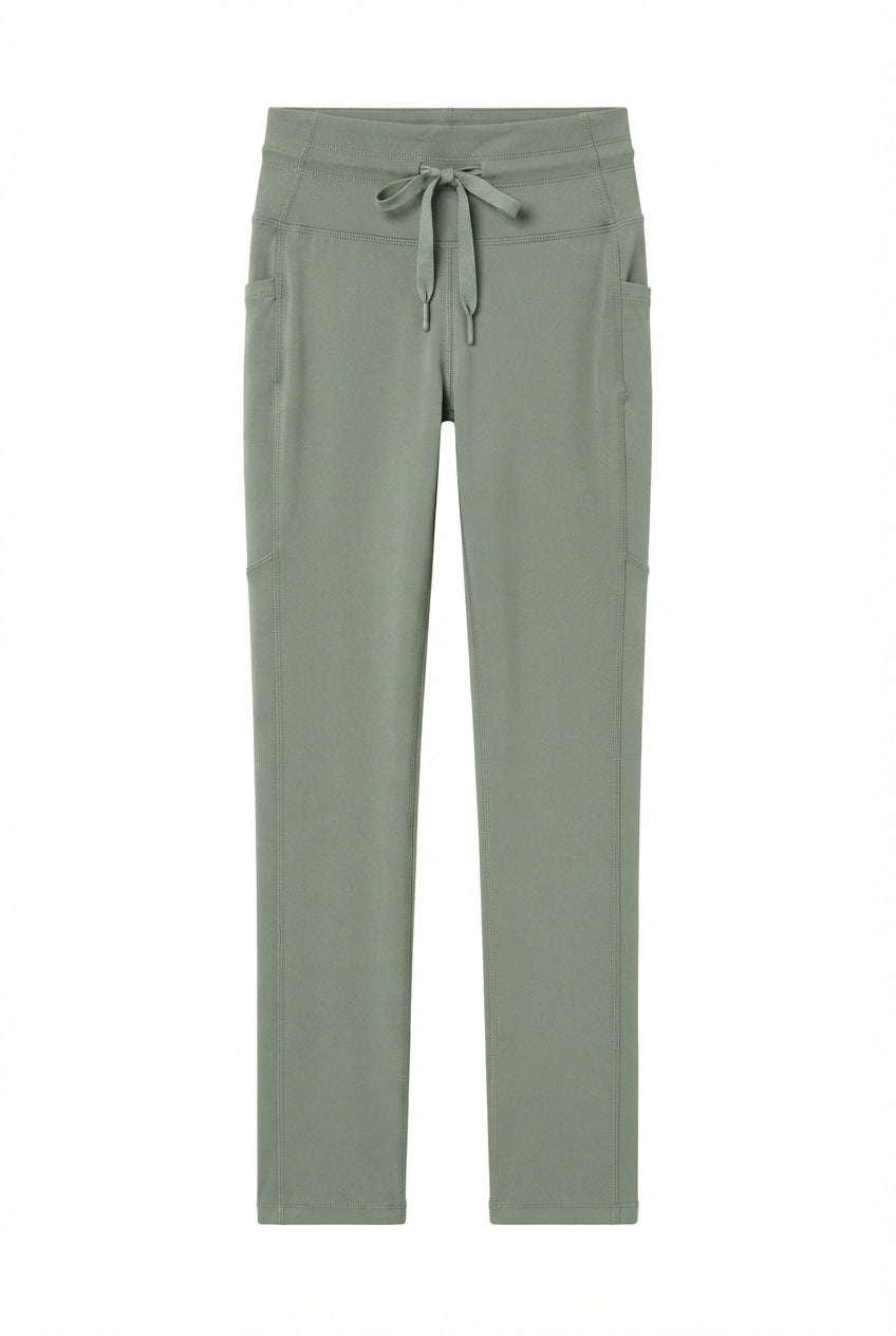 Legging verde con bolsas laterales y costuras decorativas