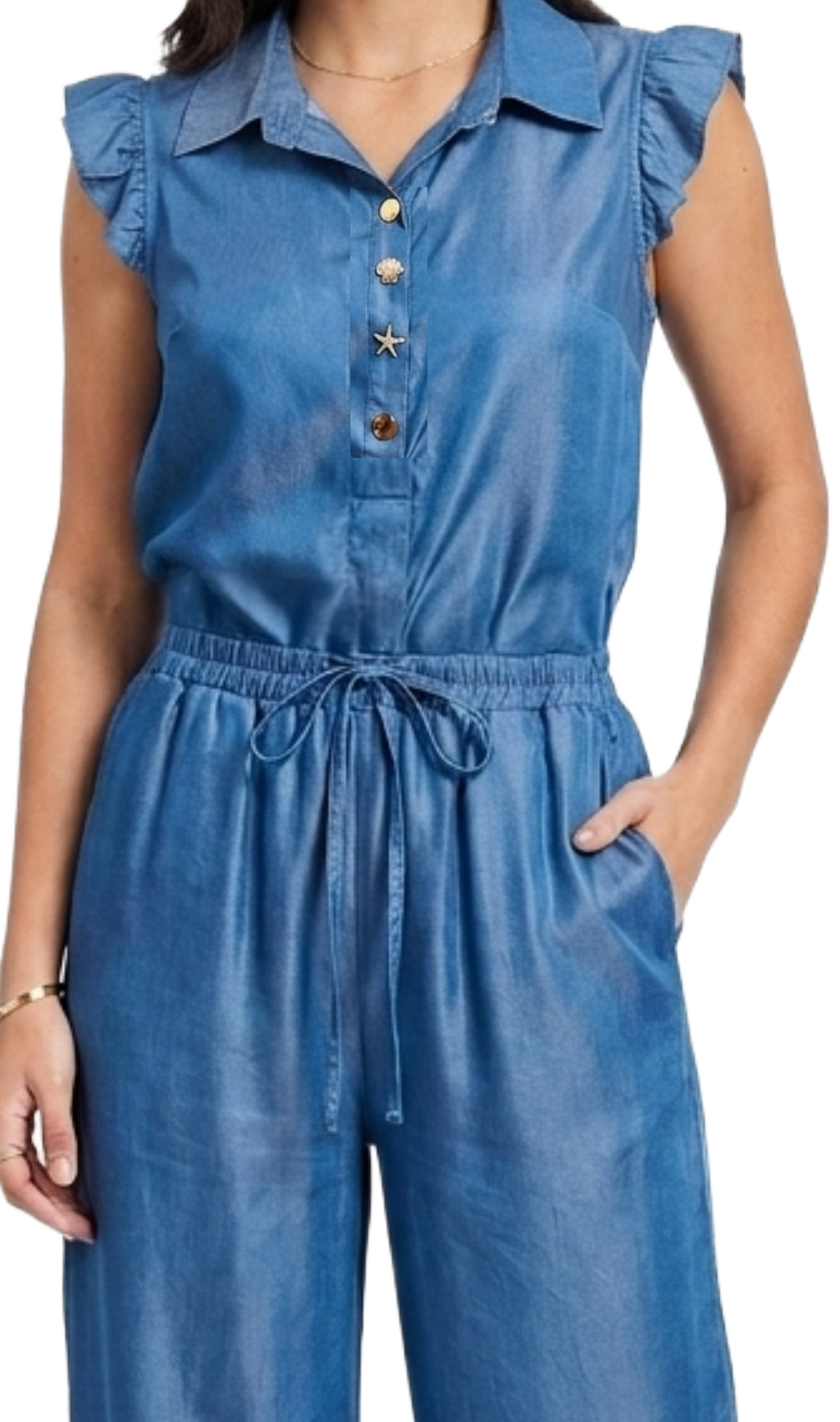 Conjunto azul de blusa con botones metalicos de figuras
